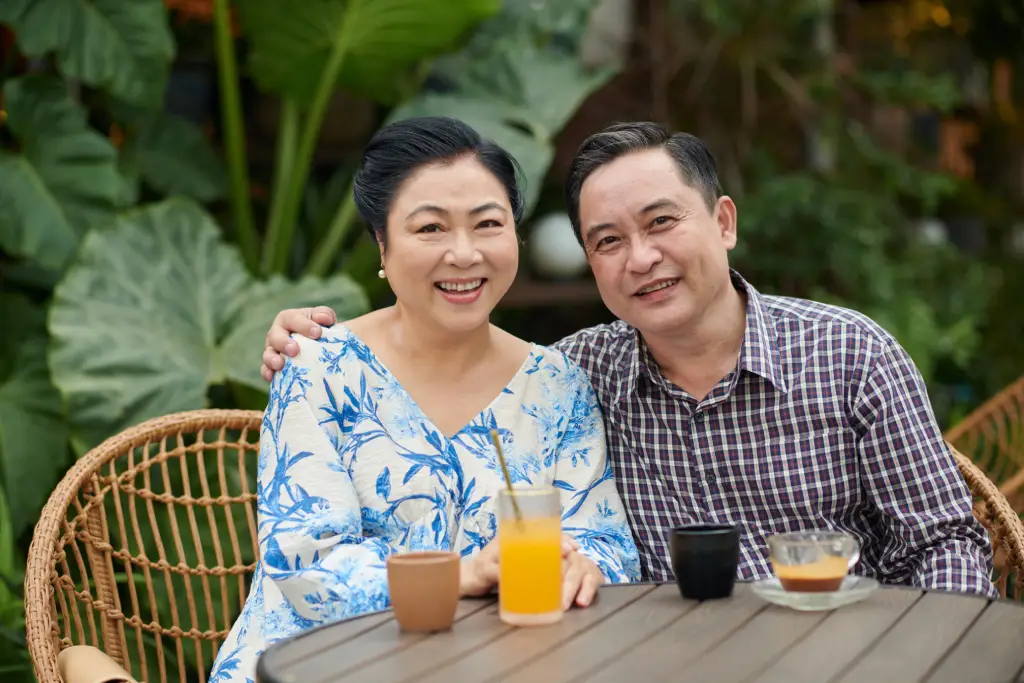 Smiling older Asian couple enjoying clear vision and daily life after cataract surgery.